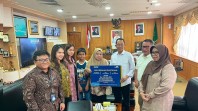 Amsakar Serahkan Santunan JKK Taspen